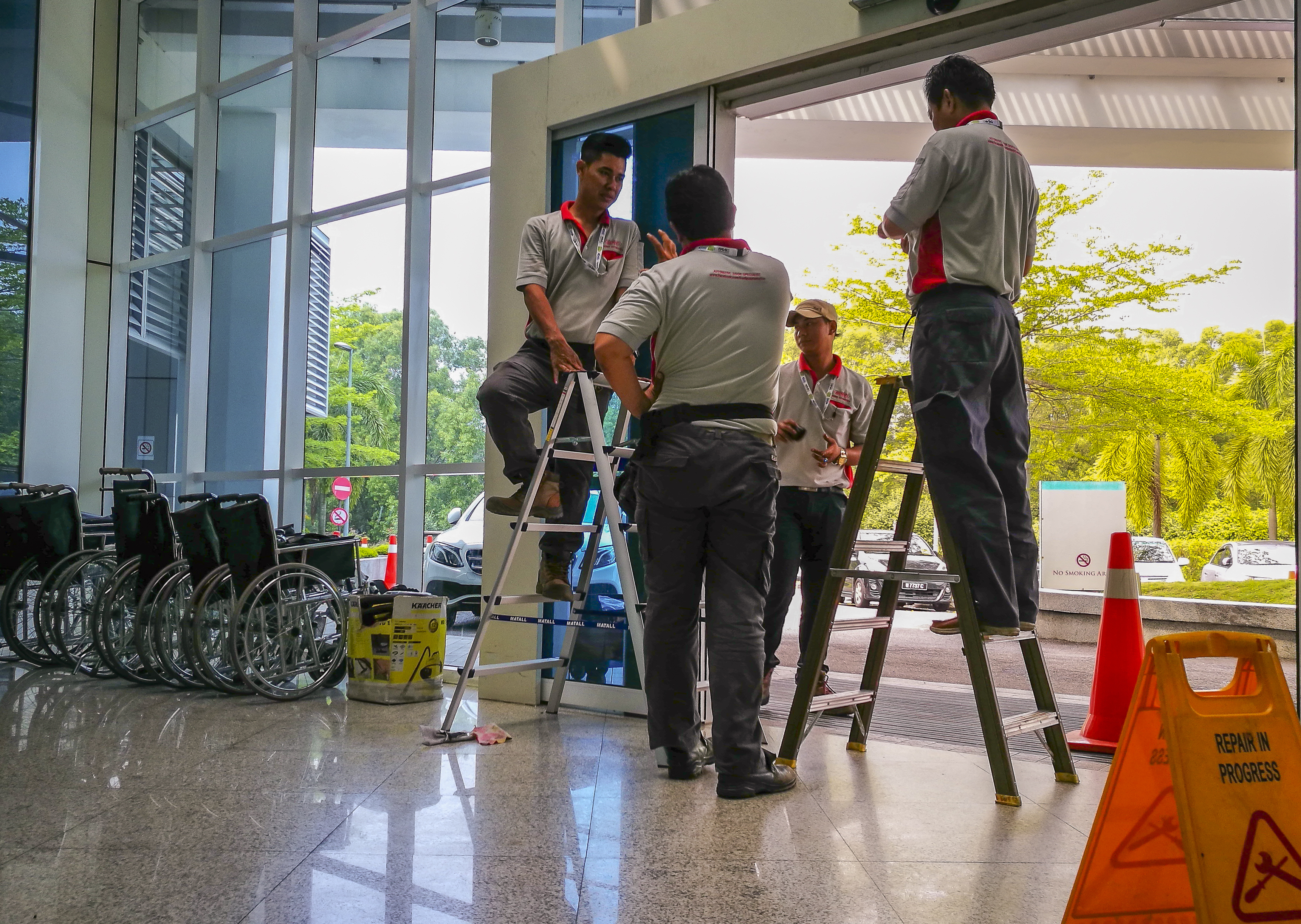 Guys working on an automatic door